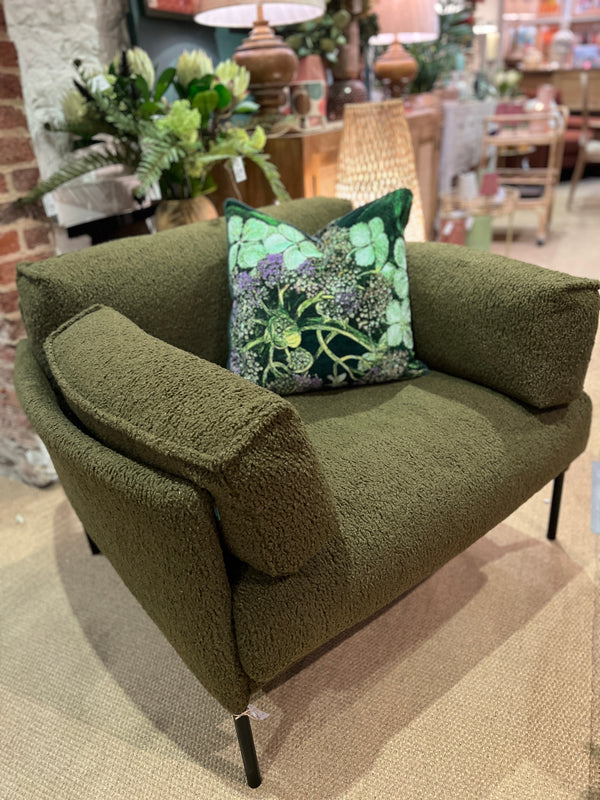 Forest green armchair in a soft boucle fabric