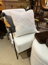 Soft pale contemporary armchair.