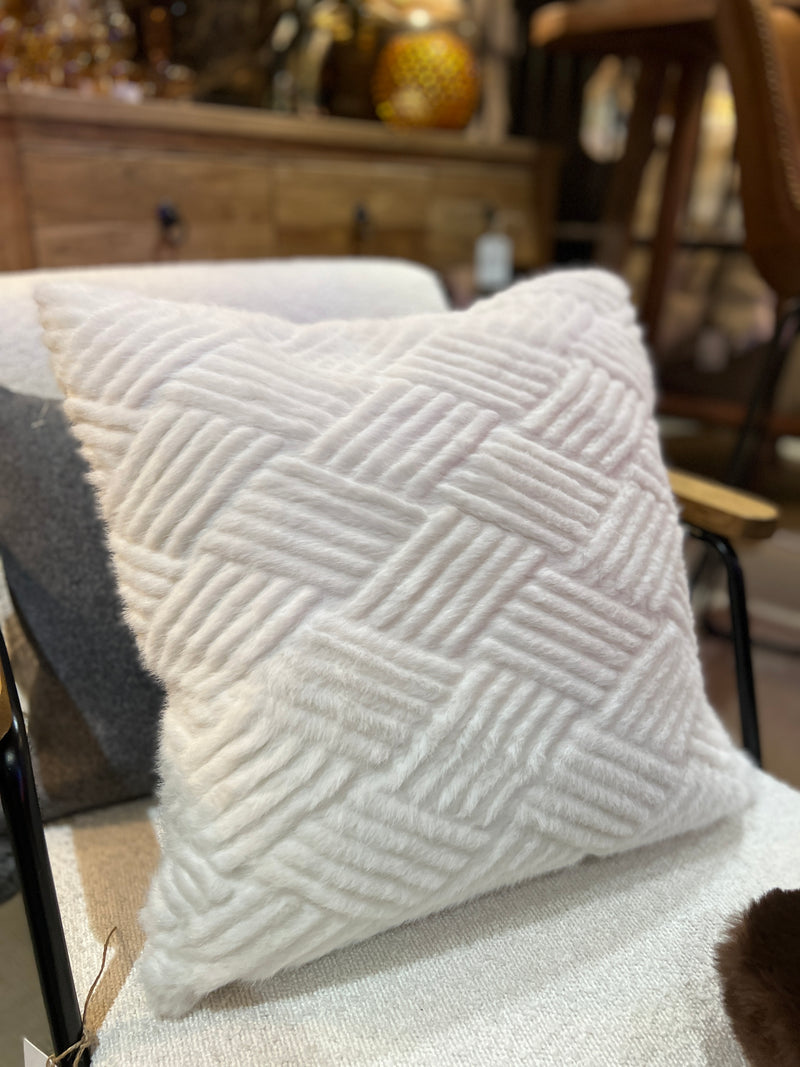 Weaved texture pale cream cushion.
